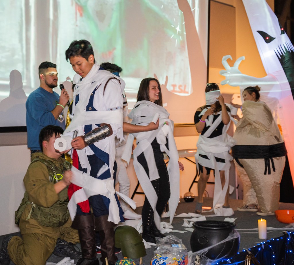 A traditional and silly game - wrap your teammate completely with toilet paper so that they become a mummy!