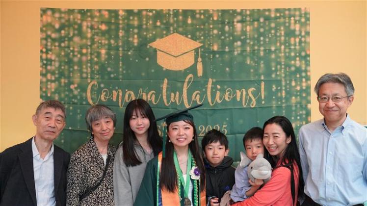 A graduating student with her family.